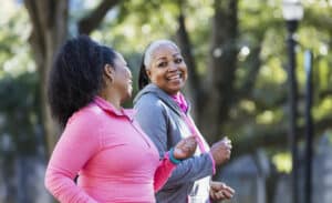 Two women going through menopause exercising