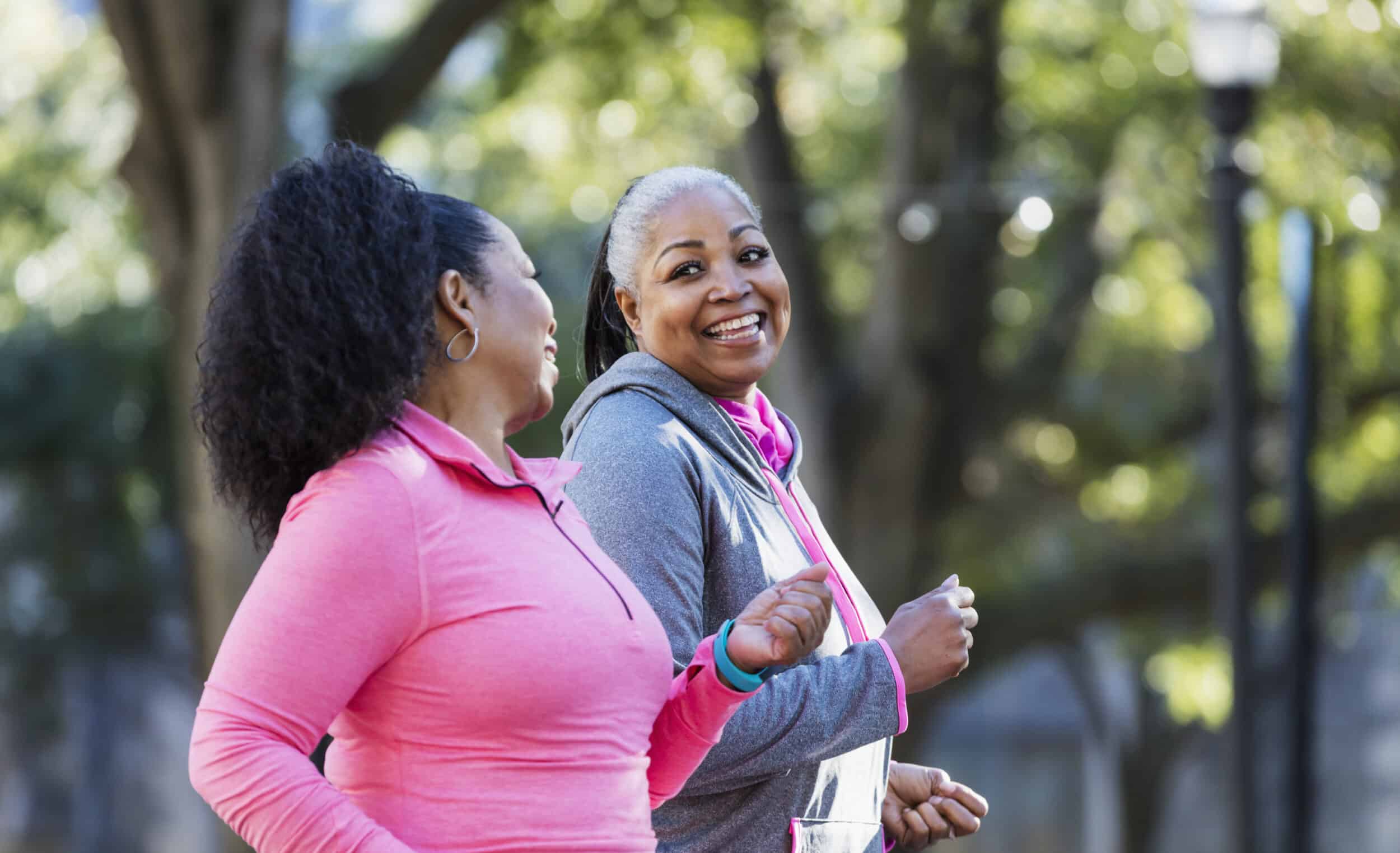 Two women going through menopause exercising