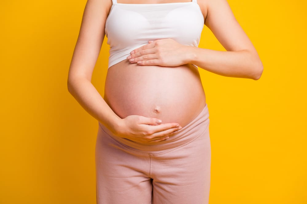 A cropped shot of a pregnant woman's stomach