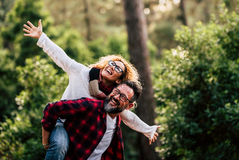 Outdoor,Happy,And,Cheerful,Caucasian,Couple,With,Glasses,Have,Fun Men’s Hormone Therapy in Houston, TX